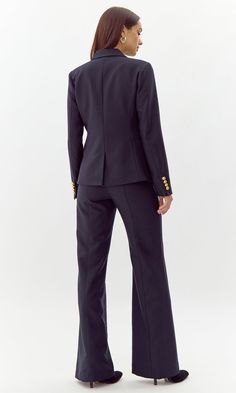 This bold blazer is adorned with gold buttons on the bodice and sleeves. The double-breasted structure also features faux, front pockets and a notched lapel. Can be matched with Colson Trousers. Blazer Double-Breasted Lined Length: 26" Chest: 17 1/4" Self: 77% Polyester, 16% Viscose, 7% Spandex Lining: 97% Polyester, 3% Spandex Hand wash in cold water with similar colors. Model is wearing a size small Style #: G247J1755 Business Blazer With Gold Buttons, Long Sleeve, Workwear Peacoat With Double-breasted Button And Suit Collar, Long Sleeve Blazer With Gold Buttons For Work, Double-breasted Business Blazer Dress With Button Cuffs, Office Peacoat With Suit Collar And Double-breasted Fastening, Double-breasted Blazer Dress With Button Cuffs For Business, Classic Blazer Dress With Gold Buttons For Work, Double-breasted Peacoat With Double Button For Work, Formal Double-breasted Peacoat With Pockets