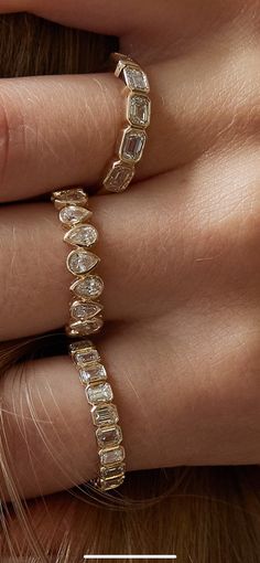 Sparkle with sophistication! Our 14K Yellow Gold Bezel Set Emerald Cut Diamond Eternity Band is the ultimate statement piece for a night out or any day, adding a touch of glamour to every occasion. 1.14 CT 2.70 Grams Alternating Pear Wedding Band, Emerald Cut Wedding Set Stack, Bezel Wedding Band With Engagement Ring, Unique Wedding Stack Rings, Unique Diamond Bands, Pear Eternity Band, Ring Stacks Wedding, Pear Engagement Ring Stack, Pear Shaped Wedding Set