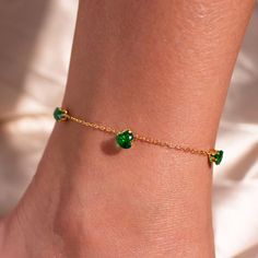 Discover our Emerald Heart Anklet - a uniquely personal "something blue" gift! <3 Featuring a stunning emerald heart charm and a green crystal design, this anklet can be customized with her initial on a back coin. It's the perfect blend of elegance and individuality, making it an unforgettable gift for any special occasion!  #YOU MAY LIKE THIS Green gemstone anklet https://www.etsy.com/listing/1761035212/green-gemstone-anklet-something-blue-for flowers anklet https://www.etsy.com/listing/1693171 Elegant Green Anklet For Gifts, Elegant Green Anklets For Gift, Heart Anklet, Crystal Anklet, Crystal Design, Blue Gift, Emerald Stone, Green Gemstones, Anklet Jewelry