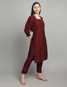 "Dress like royalty with our \"Royal Elegance\" kurta set, crafted from high-quality cotton silk fabric. The deep purple color and solid print give a classic and sophisticated touch to this traditional outfit. The bishop sleeves provide an elegant and flowy look, while the straight cut kurta adds a modern twist to the design. The square neck brings a contemporary edge to the overall look, making it perfect for any occasion, be it formal or casual." Fitted Kurta With Set-in Sleeves For Festive Occasions, Classic Fitted Kurta For Festive Occasions, Elegant Straight Kurta With Set-in Sleeves, Purple Cotton Silk Straight Kurta, Classic Fitted Cotton Kurta, Festive Cotton Silk Kurta With Set-in Sleeves, Classic Cotton Sets For Festive Occasions, Classic Cotton Festive Sets, Classic Festive Cotton Sets