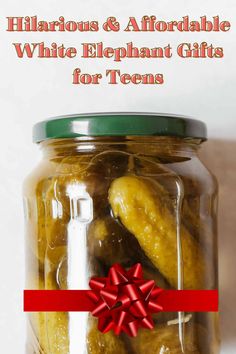 a jar filled with pickles wrapped in red ribbon and labeled hilarrious & afordable white elephant gifts for teens