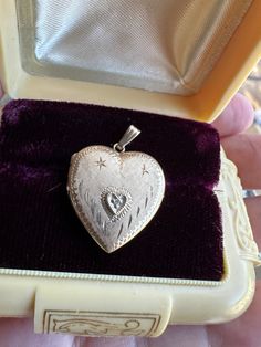 Beautiful Vintage Heart Locket   set with a tiny clear stone and beautiful etched design in the front. it is stamped 14 karat on the inside of the locket , it weighs 2.2 grams and is approx.7/8 of an inch in length and 3/4 of an inch wide. as with most vintage items this has slight surface wear , and closes securely . Message me with any questions 14k Stamped Pendant Locket Necklace For Wedding, Heirloom Yellow Gold Locket Necklace For Anniversary, Heirloom Hallmarked Locket Necklace For Anniversary, Antique Heart-shaped Yellow Gold Jewelry, Classic Double Heart Locket Jewelry, Antique Yellow Gold Jewelry With Heart Charm, Antique Yellow Gold Heart Cut Jewelry, Victorian Jewelry With Heart Charm For Anniversary, Classic Heart Jewelry For Collectibles