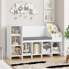 a child's playroom with toys and bookshelves in white, grey and gold