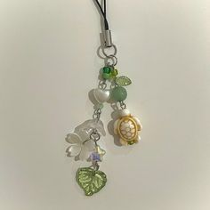 Aesthetic and lightweight, this phone charm is the perfect accessory to personalize your phone! -Length of beaded charm = 3in -Length of entire phone charm = 5in -Each phone charm is handmade and may look slightly different from listing photos -Includes one phone charm -Handmade with love <3 -Please contact me with any questions! Cheap Green Charms As Gift, Nature Coquette, Green Phone Charm, Beaded Phone Charms, Bead Keychain, Car Charms Mirror, Beaded Keychain, Aesthetic Nature, Phone Charms