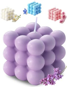 a bunch of balloons that are in the shape of grapefruits with candles on them