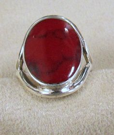 "Sterling silver ring with red faux stone. There are some dark markings to look like matrix through the stone. Very attractive. The front of the ring is 15/16\" tall. The stone part is 5/8\" wide/ The ring size is 8 1/2. Stamped 925. Good condition." Adjustable Red Oval Ruby Ring, Adjustable Oval Red Ruby Ring, Unique Red Ruby Ring Collectible, Unique Red Ruby Ring For Collectors, Adjustable Red Oval Ring, Adjustable Oval Red Ring, Unique Red Oval Ruby Ring, Collectible Oval Ruby Ring, Unique Oval Red Ruby Ring