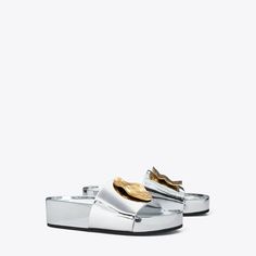 Our Patos platform slide pairs an ultra-comfortable ergonomic footbed with a touch of glamour. The effortless sandal stands out with oversized mismatched hardware. Fashion Sandals Flat, Rubber Texture, Most Comfortable Shoes, Platform Slides, Mule Sandals, High Standards, Footwear Design Women, Slide On, Designer Sandals