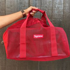 Brand New Supreme Duffle Bag Comes With Tags Red Travel Bag With Luggage Sleeve, Red Tote Duffle Bag For Travel, Red Tote Duffle Bag For Everyday Use, Red Duffle Bag Tote For Everyday Use, Red Travel Bag With Top Carry Handle, Red Rectangular Gym Bag For Travel, Red Rectangular Travel Gym Bag, Red Travel Bag With Luggage Sleeve For Daily Use, Red Rectangular Gym Bag For Everyday Use