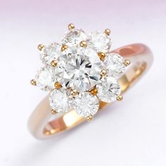 an image of a diamond ring setting on a white background with gold trimmings