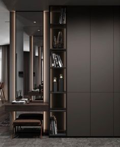 a room with bookshelves and a desk in the corner, along with a chair