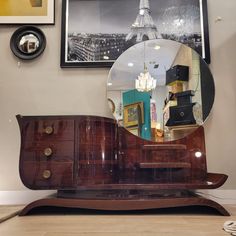 Art Deco Dressing Table, Mahogany Wood, 1930 – France  Exquisite Art Deco dressing table made around 1930 in mahogany wood. with elegant shapes, this dressing table is configured in two different parts, the furniture itself and the completely circular mirror. Its design is asymmetrical, playing with the sinuosity of the profiles, as well as with space, with its incomings and outgoings, and with light, creating magnificent shadows.  On the left it presents three registers with circular bronze handles. Next to it, in a very innovative way, a door is created that goes unnoticed, with a very curved surface, which has a lock and key. Inside, veneered with lemongrass wood in its characteristic yellowish color. This entire part, both the drawers and the door, has a glass top.  To the right, under Art Deco Bedrooms, Deco Dressing, Minimalist Vanity, Art Deco Dressing Table, Antique Oak Furniture, Bronze Handles, Art Deco Artwork, Art Deco Desk, Art Deco Vanity