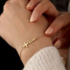 Introducing our beautiful Cross Name Bracelet, a unique and personalized piece of jewelry that combines faith and individuality. This bracelet features a delicate cross charm, symbolizing love, hope, and spiritual connection. The charm is accompanied by a customizable nameplate, where you can engrave the name of your choice. Crafted with care, this bracelet showcases a dainty design that is both elegant and meaningful. Made from high-quality materials, it ensures durability and lasting beauty. W Custom Name Cross Jewelry For Gift, Spiritual Custom Name Bracelets As Personalized Gifts, Spiritual Custom Name Bracelets For Personalized Gift, Spiritual Custom Name Bracelet For Personalized Gift, Elegant Personalized Cross Bracelets, Spiritual Cross Charm Bracelet Gift, Personalized Rosary Bracelet For Birthday, Personalized Spiritual Name Bracelet For Mother's Day, Personalized Gold Rosary Bracelet As Gift