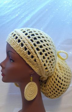 This crochet dreadloc hat is made with soft acrylic yarn in the color yellow.  The open weave of this hat makes it very airy and stretchy.  Shoulder to chest length locs or braids should fit comfortably inside this crochet hat.  Your locs can be pulled into a ponytail or worn loosely inside this mesh slouchy.  This hat is made with an opening at the back so it will fit around a head measuring up to 26" in circumference.   This loc hat has plenty of slouch and stretch.  The back opening is finished with long ties on both sides, so it easily adjusts to fit most head sizes.  Your locs should fit comfortably inside this slouchy beanie on bad hair days or days when your hair just will not cooperate.  Cover your entire head or let your dreads hang down.  Thick braids will also fit inside this be Crochet Dread Hat Pattern Free, Hats For Dreadlocks, Crochet Hair Wrap, Loose Crochet Hairstyles, Dreadlock Beanie Crochet Pattern, Loc Hat, Cute Crochet Hairstyles, Crochet Rasta Hat Pattern Free, Dreadlock Tam Hat