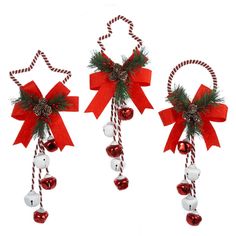 three christmas decorations with bells and bows