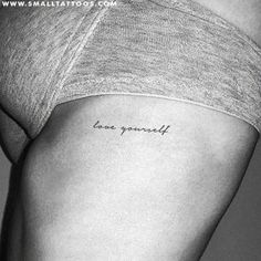 a woman's stomach with the word love yourself written on it, in black and white