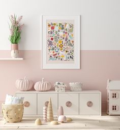 a room with pink walls, white furniture and decorations on the table in front of it