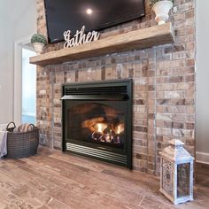 a fireplace with a flat screen tv above it