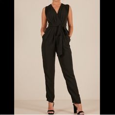 Fits More Like A Size 6ish Chic Black Jumpsuit With Tie Waist, Black Tie Waist Jumpsuit For Work, Formal Black Jumpsuit With Tie Waist, Black Belted Jumpsuit For Date Night, Formal Black Belted Jumpsuit, Chic Black Jumpsuits And Rompers For Work, Chic Black Jumpsuits For Work, Chic Black Belted Jumpsuits And Rompers, Fitted Black Jumpsuits And Rompers With Tie Waist