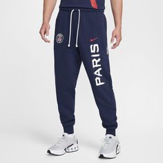 Layer up in soft French terry fabric with these Paris Saint-Germain Standard Issue pants. They drape you in lightweight, sweat-wicking fabric with unbrushed loops on the inside in a tapered-fit to help keep you dry and comfortable. Squad details show exactly where your loyalty lies. Sportswear Joggers With Logo Detail For Jogging, Navy Sporty Joggers For Loungewear, Sporty Navy Joggers For Loungewear, Navy Cotton Sweatpants Sportswear, Navy Cotton Athleisure Joggers, Navy Cotton Sweatpants For Sports, Navy Cotton Sportswear Joggers, Navy Cotton Joggers Sportswear, Navy Cotton Joggers For Sportswear