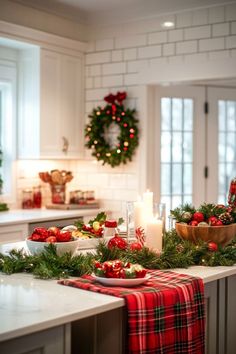 a kitchen with christmas decorations and candles on the counter