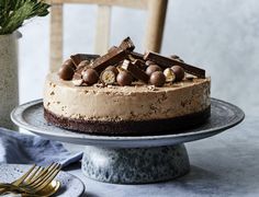 a cake with chocolate and nuts on top