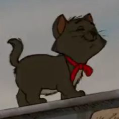 a cartoon cat standing on top of a roof with a red ribbon around it's neck