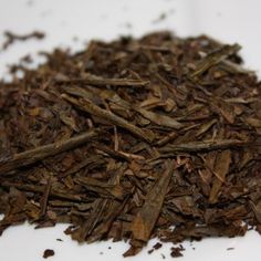 a pile of wood shavings sitting on top of a white plate