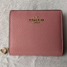 Nwt Coach Refined Pebble Leather Snap Wallet. Light Blush Color Features; 3 Card Slots, Id Window, Full Length Bill Compartment, Snap Closure, Outside Zippered Coin Pocket. Approximate Measurements 4 1/4"(L) X 3 1/2"(H) X 1"(W) Elegant Pink Leather Coin Purse, Coach Bifold Coin Purse Gift, Coach Compact Wallet For Daily Use, Compact Coach Wallets For Daily Use, Compact Coach Wallet For Daily Use, Coach Leather Coin Purse For Daily Use, Coach Coin Purse With Zipper Closure, Coach Bifold Wallet With Removable Pouch, Pink Coach Leather Wallet