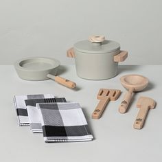 kitchen utensils and wooden spoons on a table