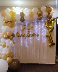 balloons and streamers are set up in front of a backdrop with the words fete cumplence