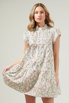 It's going to be a good day in the Arvine Floral Pleated Mini Dress! A unique and stunning floral print enchants this mini dress with pleat detailing, mock neck, cute buttons, and a belt tie around the waist. It’s such a pretty vibe you can wear out in a sunny day! - Belted- Pleated- Lining- Button front- Color: White MultiSize + Fit - Model is 5'8" and wearing size XS- Measurements taken from size S - Chest: 19"- Length: 35" Fabric Self:100 Cotton Lining:97% Polyester 3% Spandex Style Number ST Dress With Pleats, Cute Buttons, Belt Tie, Pleated Mini Dress, Sunny Day, White Mini Dress, Sunny Days, Good Day, Mock Neck