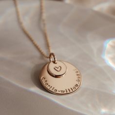 The big sister of our long-time favourite, Soren, the Saffron pendant combines the beauty of the stacked Soren with all the space of our beloved Charlotte. This leaves plenty of space for loved ones' names, birthdates or special text. Personalise with your text curved around the edge of the large pendant and an initial or symbol in the centre of the small pendant. The nature of the stacking pendants means the larger pendant will show wear from the smaller pendant rubbing against it. Crafted with Rose Gold Charm Necklace For Mom, Rose Gold Medallion Jewelry For Mother's Day, Special Text, Zodiac Sign Necklace, Sign Necklace, Oval Necklace, Symbol Necklace, Small Pendant, Rose Gold Necklace