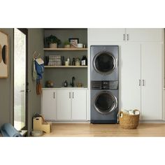 the front load washer and dryer are in this laundry room