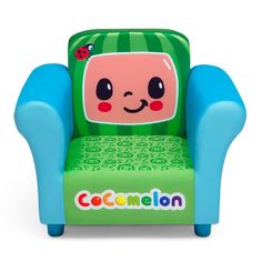 a green and blue children's chair with a cartoon character on the back, sitting in front of a white background