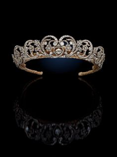 a tiara on a black background