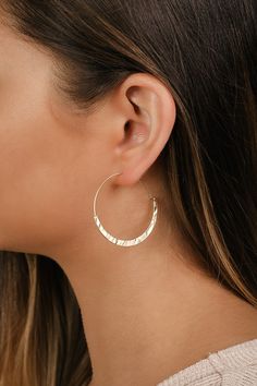 The Lulus Sunshine Circle Gold Hoop Earrings are giving us major Boho vibes! Hammered gold accents the bottom of these trendy minimalist hoop earrings that thread through the ear, giving them a perfectly chic and simple look! Post backs. 1. 5" diameter. Man made materials. Imported. Lulus | Sunshine Circle Gold Hoop Earrings. Homecoming Accessories, Rusty Rose, Big Hoop Earrings, Earring Trends, Chic Earrings, Hammered Gold, Accessories Jewelry Earrings, Girls Earrings, Boho Vibe