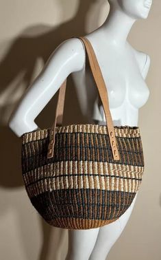 You don't have to be a millionaire to elevate your style and fashion, you need creativity and Arts. We African 1 Stores offers to you the most modern hand made tote bag woven 100% from sisal with Quality leather straps locally tunned from cows.  These beautiful handmade Tote bag originated from craftsmen living in Eastern Community in Kenya, the Akamba. Our Tote bags are woven using colored sisal and leather.The woven bag is made from products which are entirely eco-friendly and sustainable, lea Brown Large Capacity Crossbody Beach Bag, Brown Crossbody Beach Bag Large Capacity, Everyday Tote Beach Bag With Mobile Phone Pocket, Everyday Tote Beach Bag With Mobile Phone Bag, Mobile Phone Crossbody Crochet Bag For Shopping, Brown Beach Bag With Adjustable Strap For Shopping, Shoulder Straw Bag For Shopping With Mobile Phone Pocket, Eco-friendly Crossbody Bucket Bag For Daily Use, Brown Woven Crossbody Bag