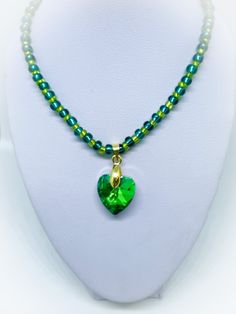 This is a gorgeous Green Glass Heart Handmade Necklace with lime and teal green glass seed beads with a stunning green crystal glass heart pendant as the centrepiece. It is approx 16 inches in length and finished with a gold colour spring ring clasp. I also have earrings available to match in my shop as part of my crystal collection which can be viewed by clicking this link www.etsy.com/uk/listing/1502520099/teal-green-crystal-glass-heart-handmade  To view more JulieDeeleyJewellery items from my shop please click link below : http://www.etsy.com/shop/JulieDeeleyJewellery JULIE DEELEY JEWELLERY SOCIAL MEDIA LINKS Follow me on Facebook: www.facebook.com/juliedeeleyjewellery Follow me on Twitter: twitter.com/julie_deeley Follow me on Pinterest: pinterest.com/juliedeeley Follow me on Instagram Heart-shaped Faceted Beads Necklace For Jewelry Making, Green Heart-shaped Beaded Necklace Gift, Green Beaded Chain Crystal Necklace Gift, Green Crystal Necklaces With Colorful Beads As Gift, Green Crystal Necklace With Colorful Beads As Gift, Green Crystal Necklace With Colorful Beads For Gifts, Green Beaded Necklace For May Birthstone, Handmade Green Crystal Necklace For May Birthstone, Green Heart-shaped Beaded Necklaces