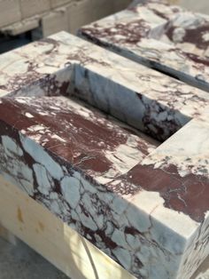 two marble blocks sitting on top of each other