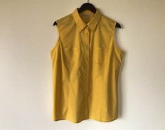 Vintage Women Shirt Thin Yellow Shirt Women Home Shirt Lightweight blouse sleeveless Shirt Gift for Mom shirt Size Medium Label Size: 48 Measurements (lying flat): Pit to pit - 23 inch Shoulders - 17inch Length - 25.5 inch Material: Cotton Please check measurements to insure a proper fit. Remember to allow yourself some extra room for movement. You can compare these with something from your closet that fits you well. This blouse will come to you freshly laundered and ready to wear. Please convo Yellow Shirt Women, Yellow Shirt, Blouse Sleeveless, Mama Shirts, Yellow Shirts, Extra Room, Vintage Women, Women Shirt, Sleeveless Shirt