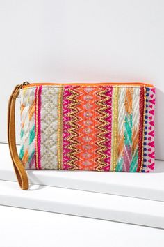 This handmade ethnic pattern clutch is the perfect accessory for modern life. Its fine cotton yarn dye with jacquard pattern adds to its unique design, while beads and leather wristlet provide a comfortable and stylish hold. Choose this practical and fashionable clutch to make any outfit pop! Shell: 100% Cotton Trim: Suede Leather Lining: 100% Polyester Measurements: L 5.25" W 8.5" Wristlet 7" Its Fine, Handmade Clutch, Ethnic Patterns, Jacquard Pattern, Wristlet Clutch, Modern Life, Leather Wristlet, Yarn Dyeing, Cotton Yarn