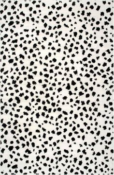 an animal print rug with black and white spots