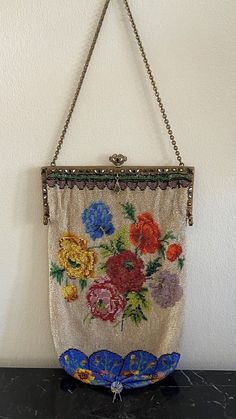 "For your consideration is a stunning antique micro beaded Victorian purse, decorated with enamel and jewels. It measures 10.5\" long (17.5\" with the chain handle) by 6 1/4\" wide. As shown on the posted photos, it has signs of consistent wear inside and the bottom tassel is damaged. Also, the opposite side has been sewn to repair some sort of damage.  IMPORTANT DISCLAIMERS  We always take plenty of photos and provide detailed descriptions of our items. Therefore, you are asked to please check ALL posted photos and review the Description Section before purchasing an item from our store. Before listing, we clean and inspect our items for neatness and accuracy. However, if a problem with the purchased item arises, we have a very customer friendly return policy. TAXES: In order to comply wit Victorian Purses, Jewel Frames, Embroidered Purse, Bijoux Art Nouveau, Vintage Evening Bags, Beaded Beads, Victorian Period, Floral Purse, Beaded Bag