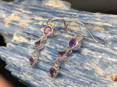 Multi-Stone Amethyst Drop Earrings // 925 Sterling Silver Hypoallergenic Hook Backing Weight: 3 grams Length: 1.8 inches Stone: natural amethyst Perfect if you prefer light weight smaller design earrings. Bali Earrings, Bali Silver, Swirl Ring, Amethyst Earrings, Multi Stone, Amethyst Ring, Chandelier Earrings, Sterling Ring, Alex And Ani Charm Bracelet