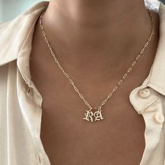 Elevate your style with our Everyday Old English Initial Necklace, featuring sparkling cubic zirconia details. This piece adds a touch of elegance and personalization to your daily look. Choose single or double letters—up to 2 letters only. Choose between 3 different types of chains and lengths. Important: Please select an Old English Initial Charm (+$12) to complete your purchase. Without the charm, you’ll receive just the chain. Why You'll Love It: Versatile Design: Perfect for wearing solo or Dainty Diamond Initials Name Necklace, Gold Initial Pendant Name Necklace With Diamond Accents, Cubic Zirconia Initial Pendant Name Necklace As Gift, Gift Diamond Accents Initial Pendant Name Necklace, Gold Initial Necklace In Cubic Zirconia, Elegant Initial Pendant Necklace With Letter Beads, Everyday Initial Necklace With Diamond Accents, Initials Cubic Zirconia Name Necklace For Gift, Initials Cubic Zirconia Name Necklace As Gift