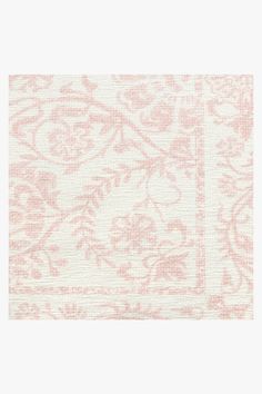 a pink and white floral pattern on fabric with an off - white border in the middle