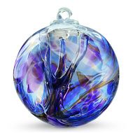 a blue glass ornament on a white background