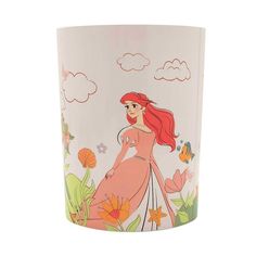 the little mermaid glass is shown with an image of ariel and flowers on it's side