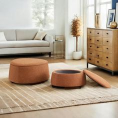 a living room filled with furniture and a large window