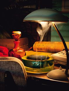 a desk lamp sitting on top of a wooden table